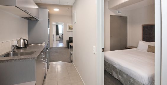 dedicated 2-bedroom apartment kitchenette and bedroom